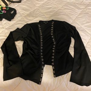 Black top with clipped front and loose sleeve ends